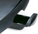 Young couple cooking together indoors using Ninja GR101, hood up grilling steaks, laughing and enjoying the moment, modern minimalist kitchen, realistic body language, shallow depth of field, cinematic lifestyle photography, very natural and relatable