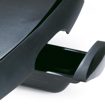 Young couple cooking together indoors using Ninja GR101, hood up grilling steaks, laughing and enjoying the moment, modern minimalist kitchen, realistic body language, shallow depth of field, cinematic lifestyle photography, very natural and relatable